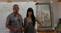 Portrait of Victor Khromin: Artist Victor Khromin in his art studio with his daughter